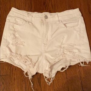 Distressed white jean shorts